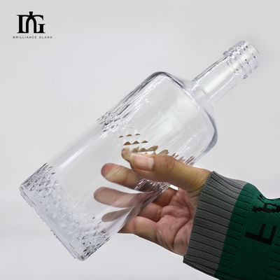 Η επιφάνεια του οξέος στρογγυλή 550 ml 700 ml οινοπνευματώδη ποτά γυάλινο μπουκάλι για ανθρακούχα ποτά
